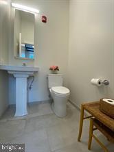 30 MacLean Street, Unit 3 Princeton, NJ 08542 - Photo 4 of 8 a bathroom with a sink a toilet and mirror