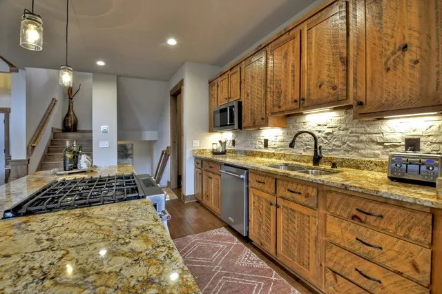 a bathroom with double sink and a mirror
