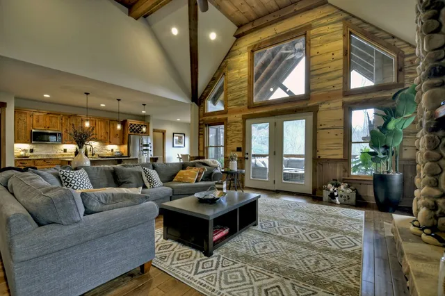a living room with fireplace furniture and a flat screen tv