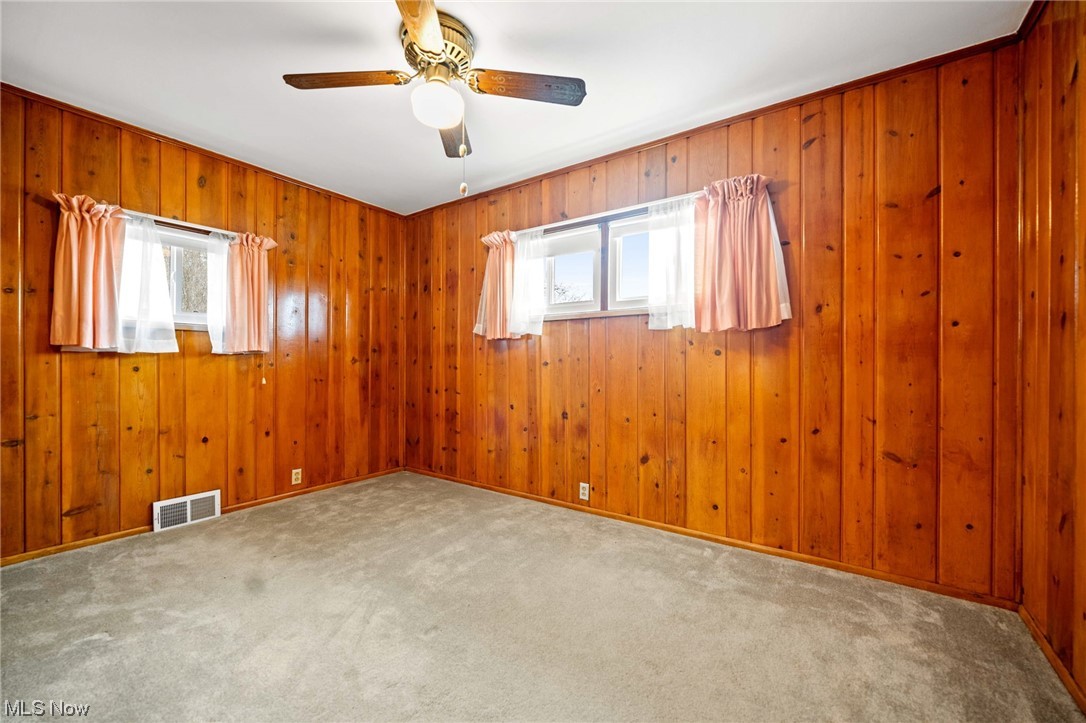 7221 Euclid Chardon Road Kirtland, OH 44094 - Photo 17 of 30 Well lit family room with tongue and groove wood panel