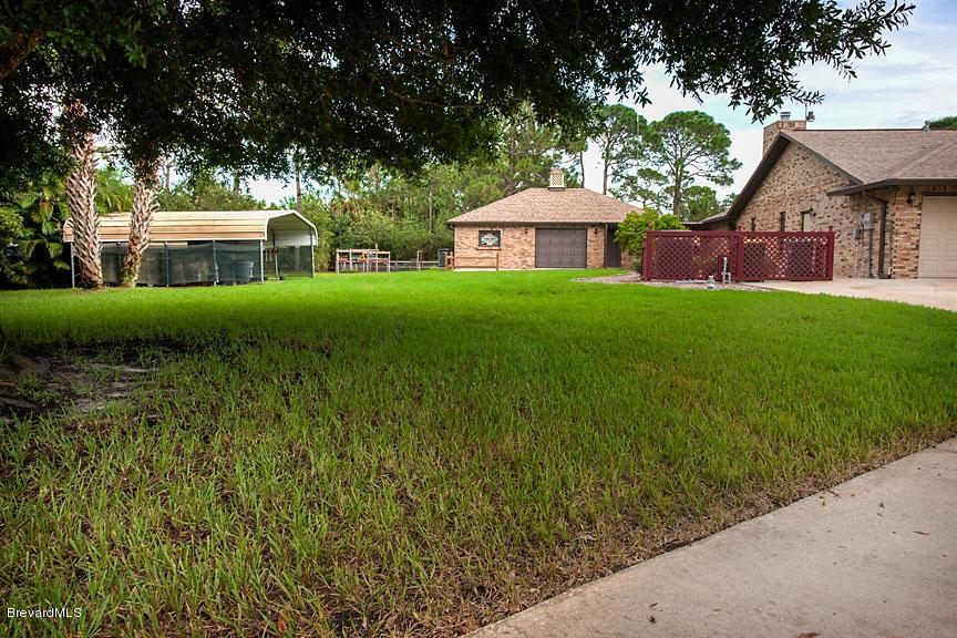 2751 Harlock Road Melbourne, FL 32934 - Photo 20 of 25 Front_Of_Outbuilding_And_Garden