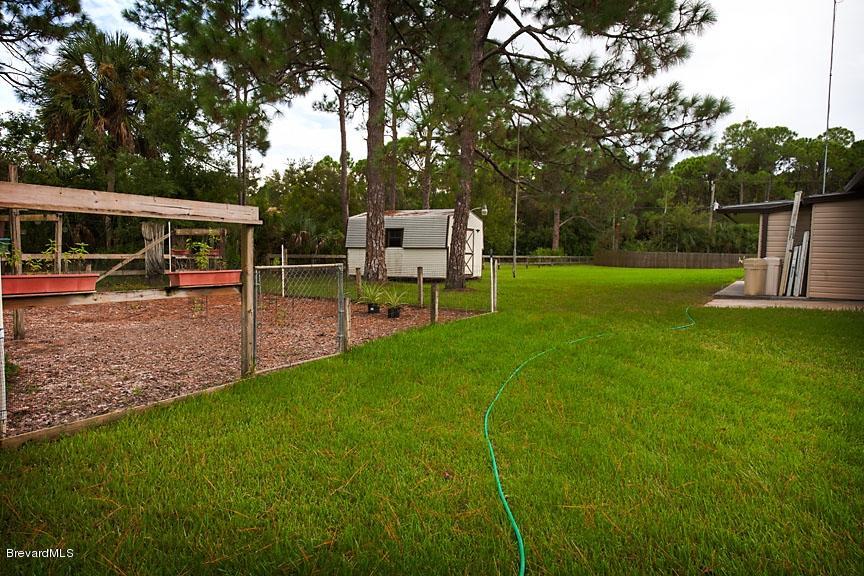 2751 Harlock Road Melbourne, FL 32934 - Photo 10 of 25 Back_Yard_From_North_Side_Of_Property