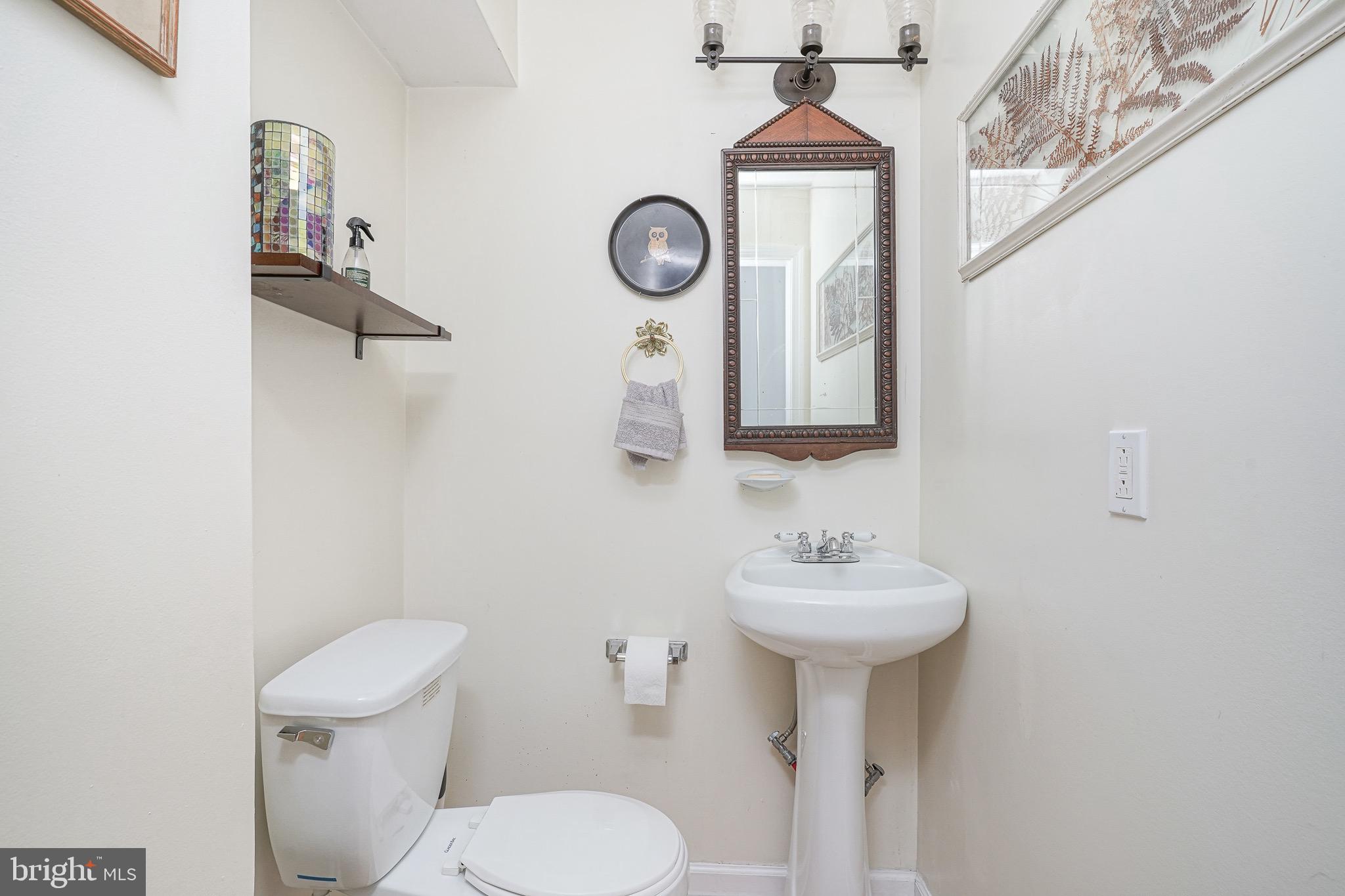 2111 Manton Street Philadelphia, PA 19146 - Photo 11 of 37 a bathroom with a toilet sink and mirror