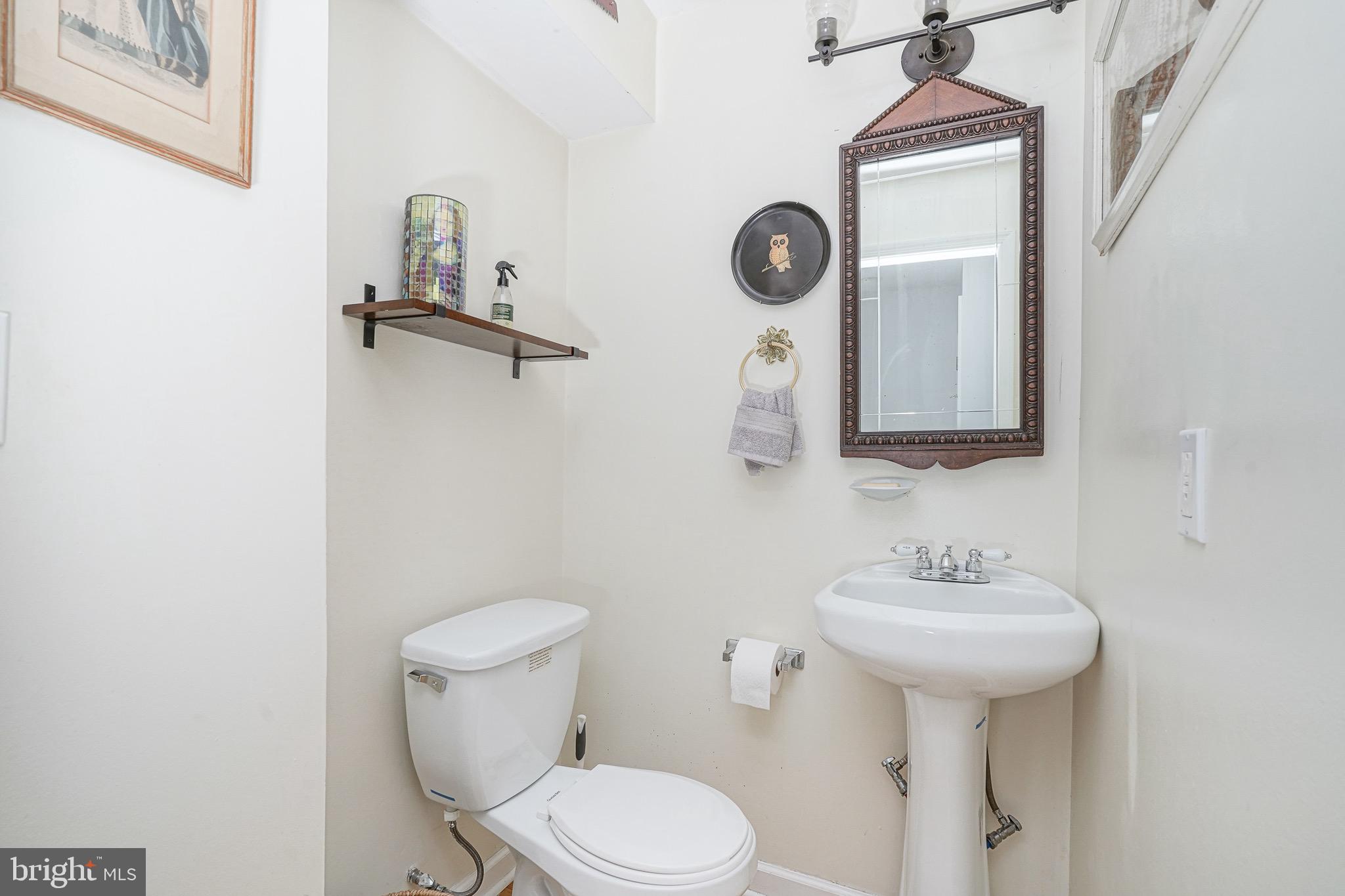 2111 Manton Street Philadelphia, PA 19146 - Photo 12 of 37 a bathroom with a toilet sink and mirror