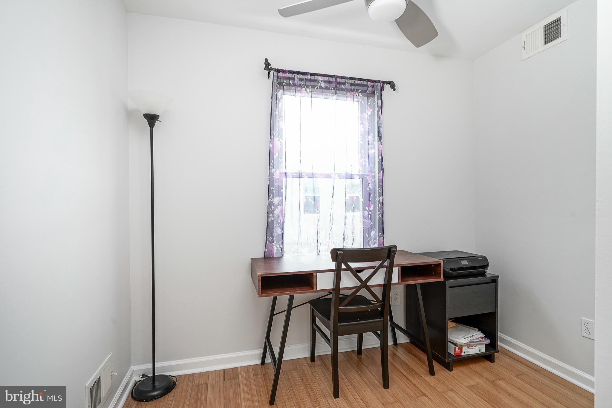 2111 Manton Street Philadelphia, PA 19146 - Photo 15 of 37 a view of a workspace with furniture and wooden floor