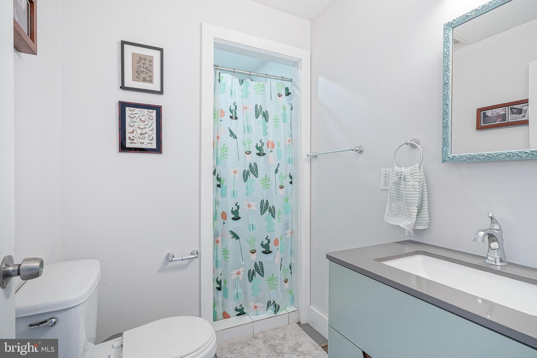 2111 Manton Street Philadelphia, PA 19146 - Photo 24 of 37 a bathroom with a granite countertop sink toilet and shower