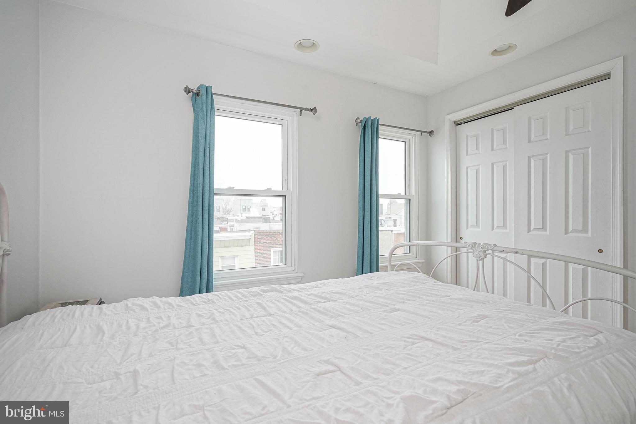 2111 Manton Street Philadelphia, PA 19146 - Photo 29 of 37 a bedroom with a large bed and a large window