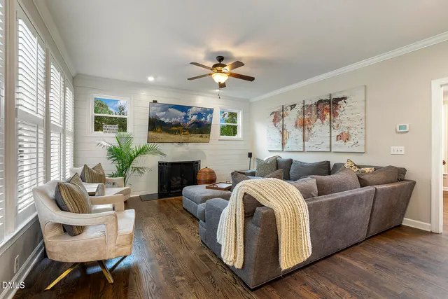 a living room with furniture and kitchen view