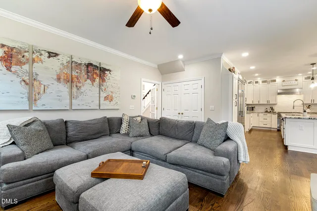 a kitchen with granite countertop cabinets stainless steel appliances and wooden floor