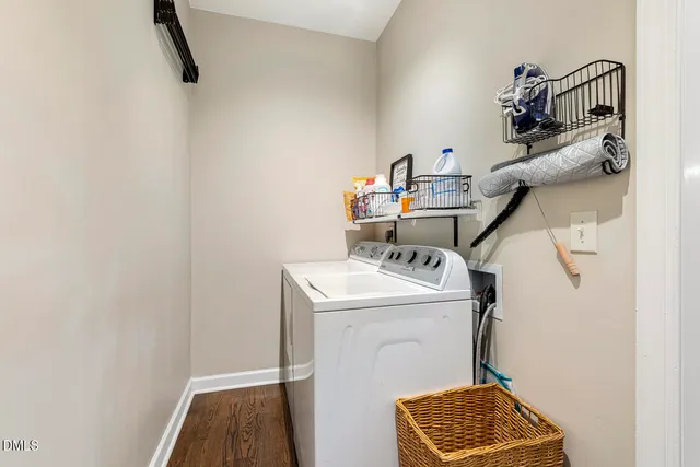 a spacious bedroom with a bed a couch and a window