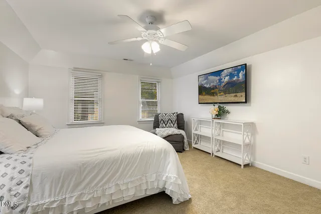 a bathroom with double vanity sinks and a large mirror