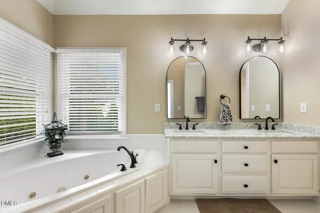 a utility room with cabinets washer and dryer