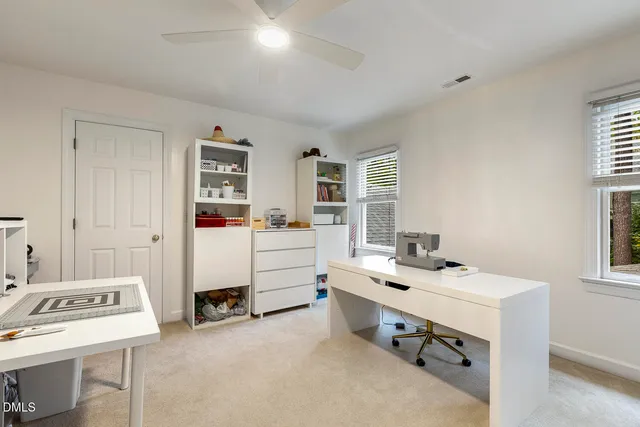 a bathroom with a granite countertop sink toilet and mirror