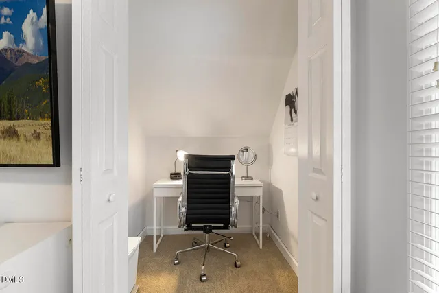a view of a chair and table on the roof deck