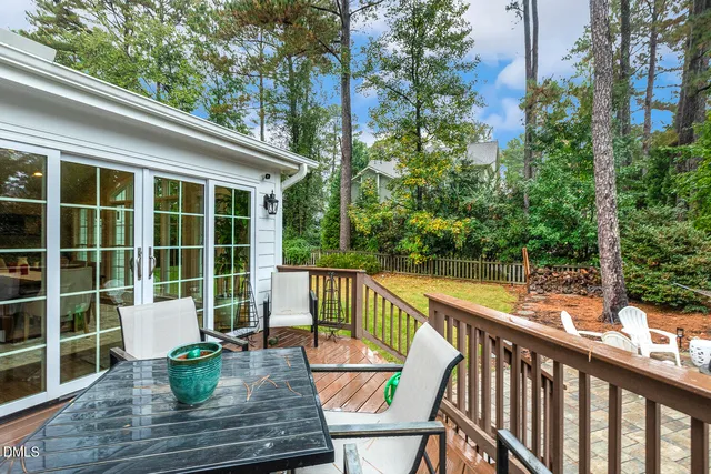 a view of a patio with table and chairs and couches