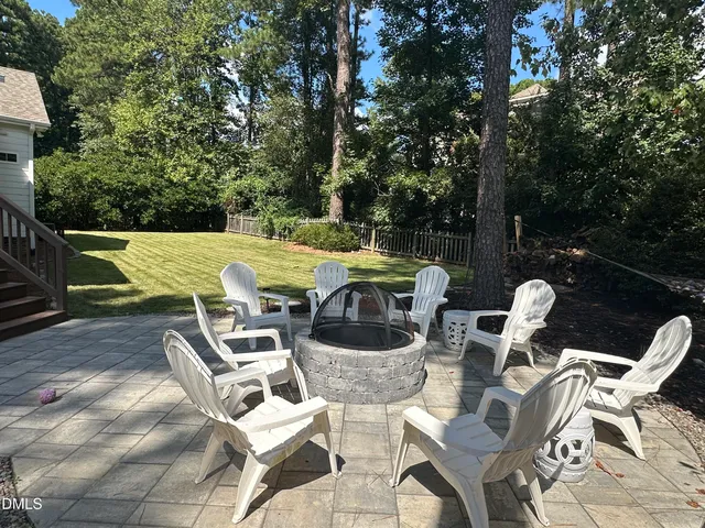 a view of a house with backyard porch and sitting area