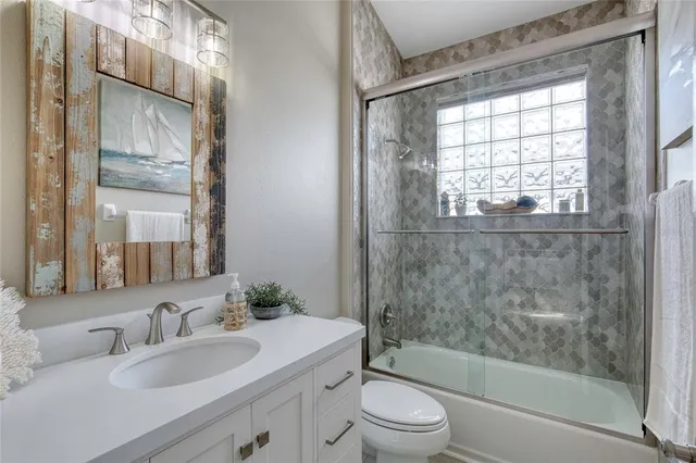 a bedroom with a bed and a night stand