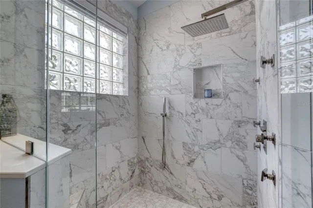 a bedroom with bed and wooden floor