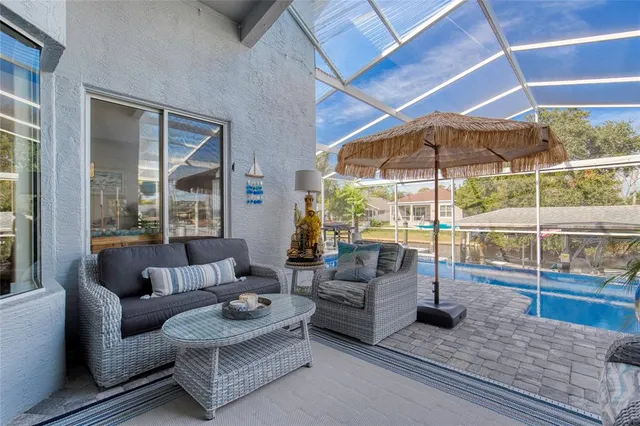 a view of a swimming pool with a patio