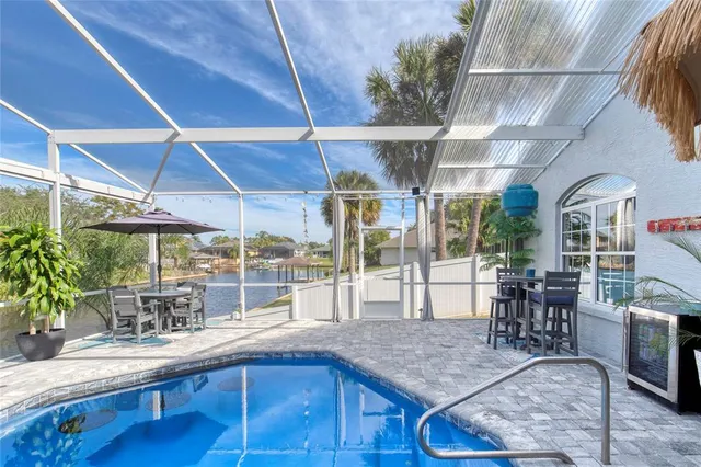 a view of a swimming pool with a patio