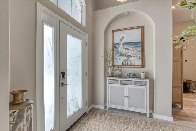 a view of a hallway to rooms