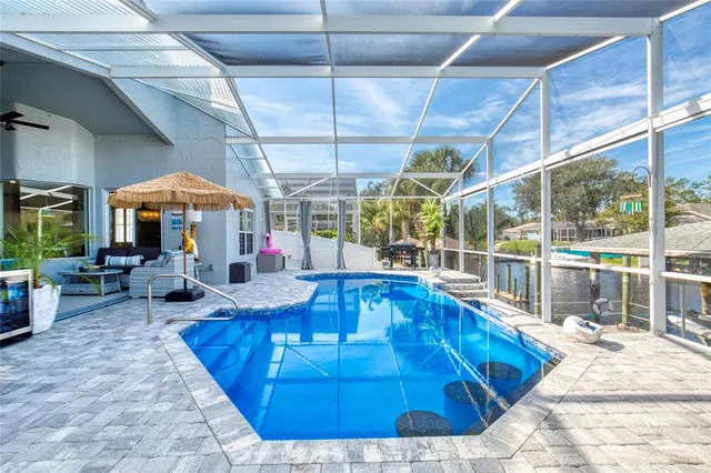 a view of a lake with a table and chairs