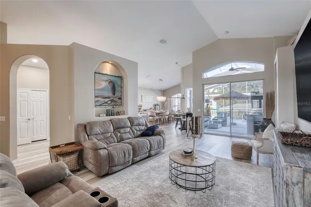 a living room with furniture or couch and a flat screen tv
