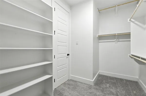 a view of an empty walk in closet
