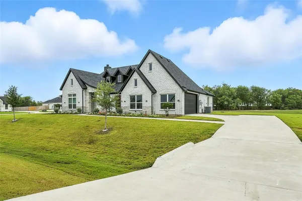 a view of house with outdoor space and swimming pool