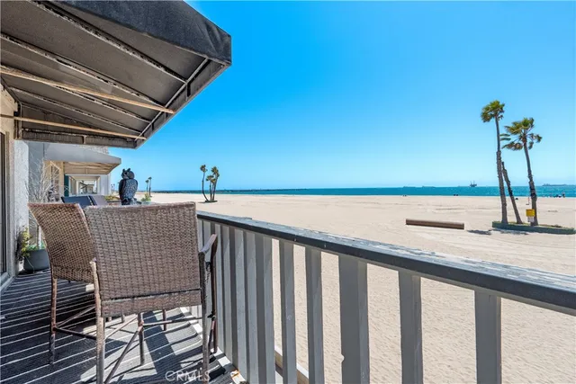 a view of a balcony and car parked