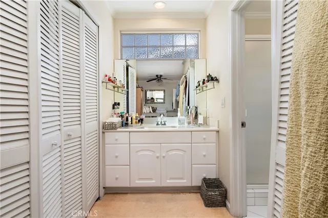 a bathroom with a sink a mirror and a shower