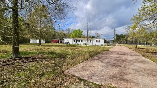 a view of a street with houses on both side