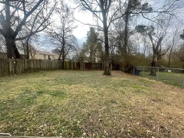 a backyard of a house with lots of green space