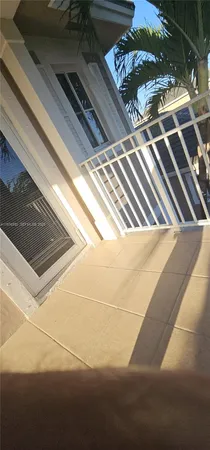 a view of balcony with wooden floor