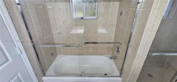 a view of an empty room with closet area