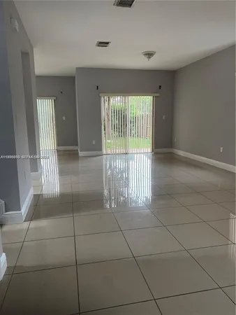 a view of an empty room and window