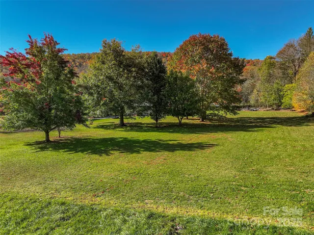 a view of a golf course with a lake view