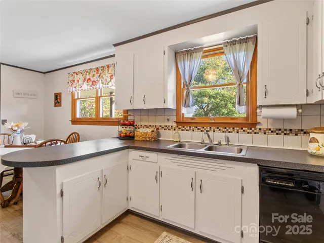 a kitchen with sink cabinets and window