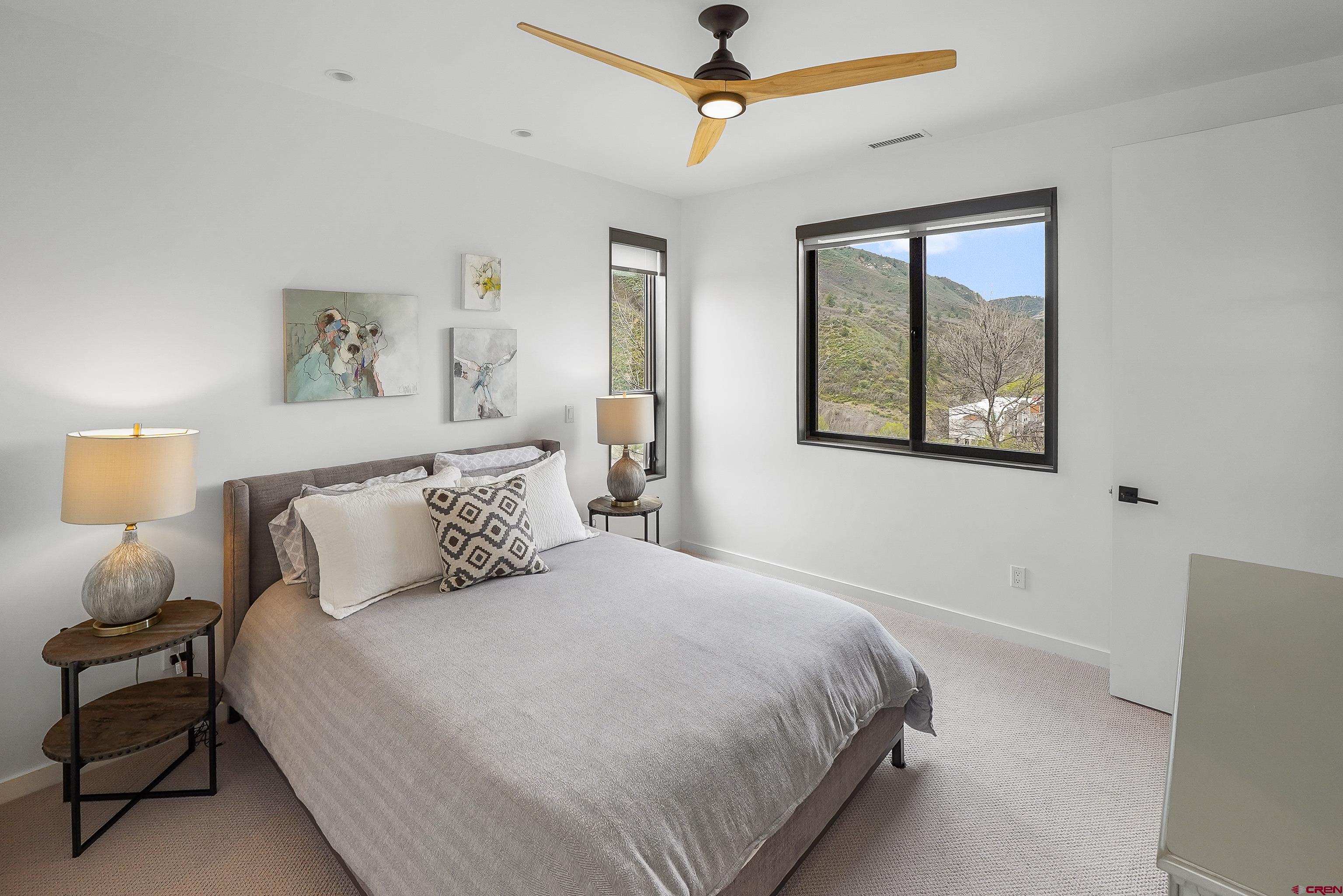 239 Rock Point Drive, Unit B Durango, CO 81301 - Photo 31 of 45 a bedroom with a large bed and a window