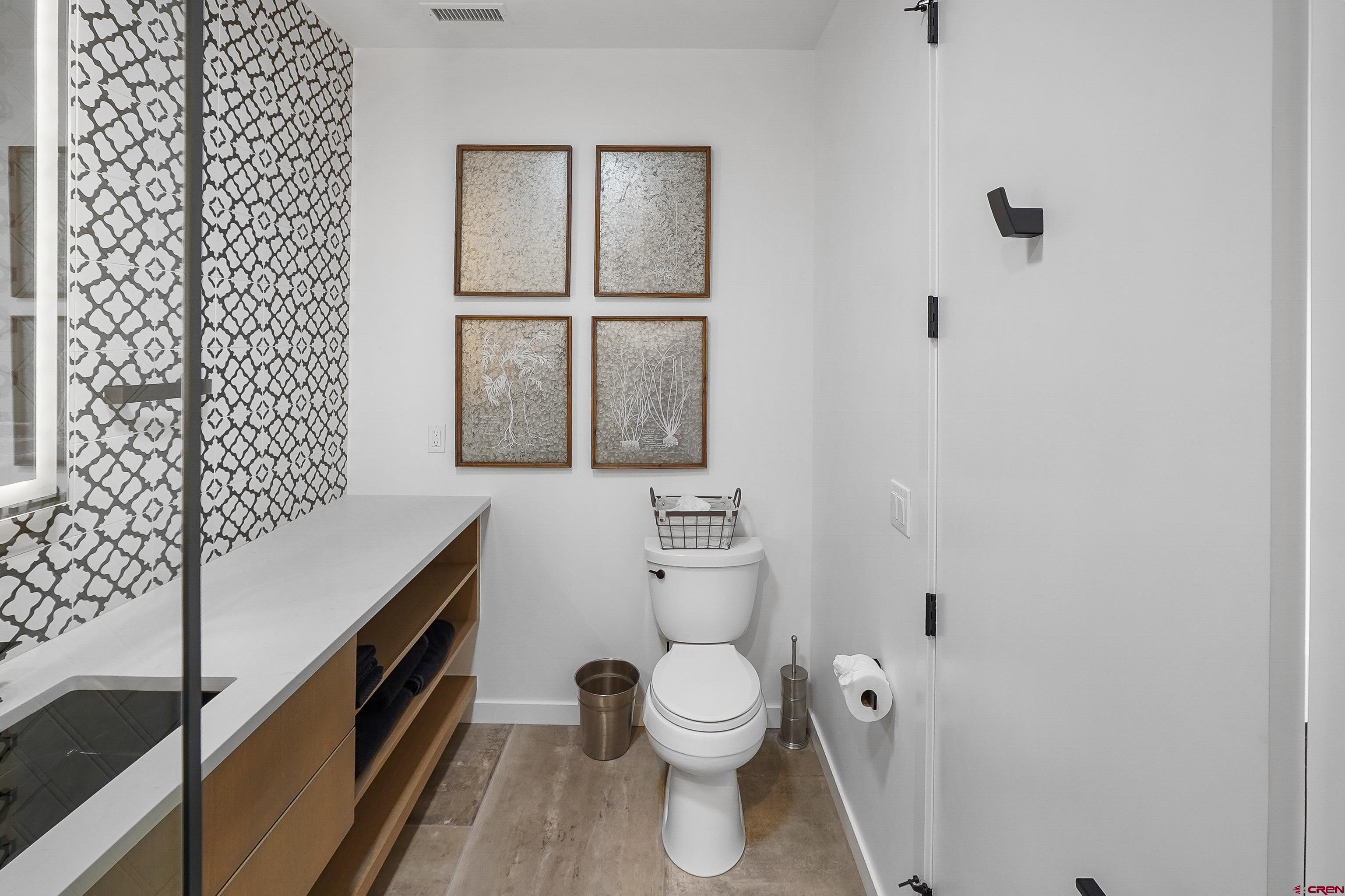 239 Rock Point Drive, Unit B Durango, CO 81301 - Photo 35 of 45 a bathroom with a toilet a sink and a window