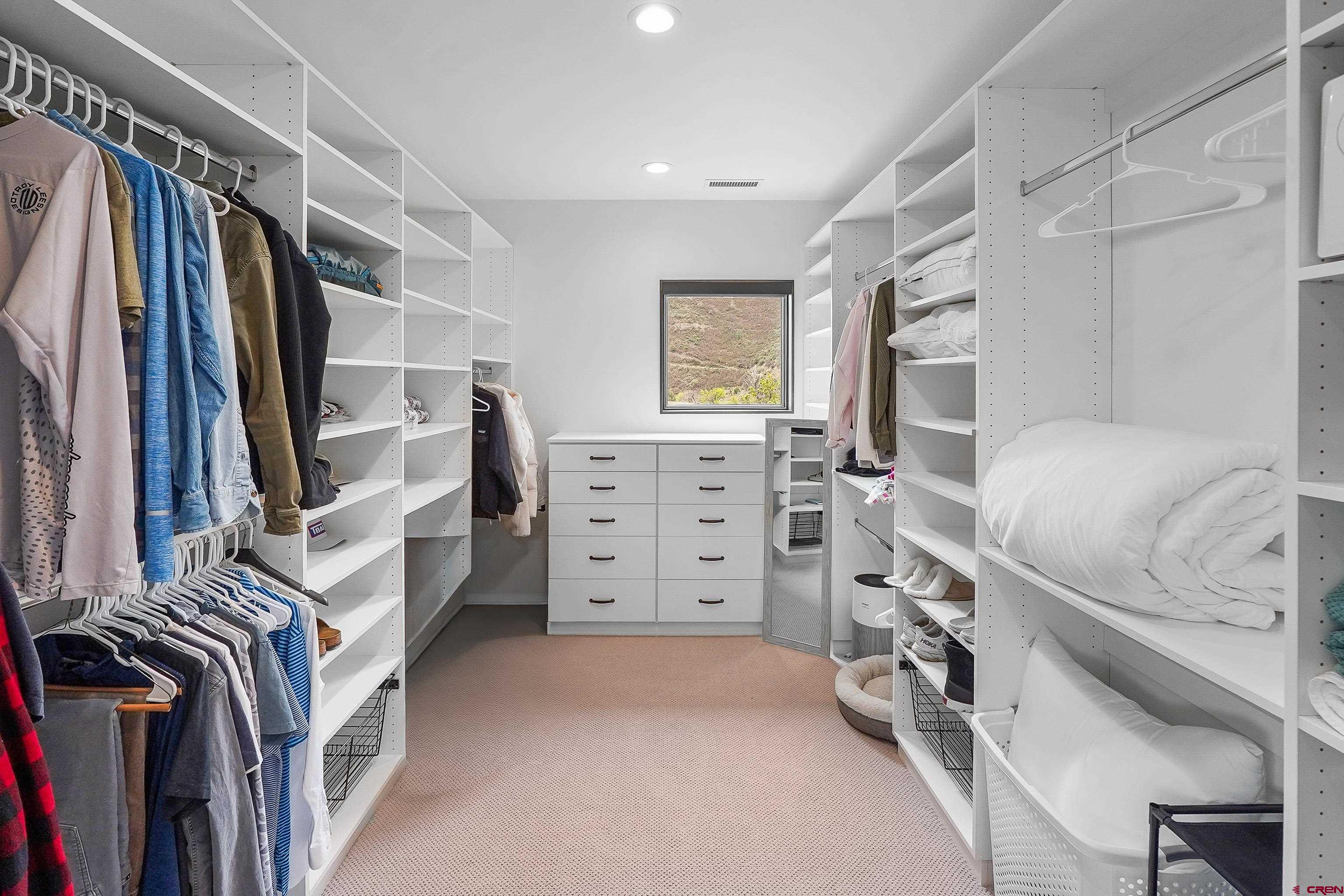 239 Rock Point Drive, Unit B Durango, CO 81301 - Photo 40 of 45 a view of walk in closet with clothes and shoes