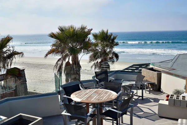 a view of a livingroom with furniture and a potted plant