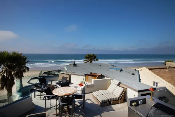 a view of a patio with table and chairs potted plants