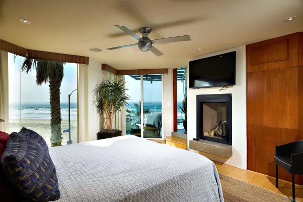 a bedroom with a large bed and a large window