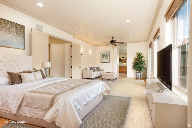 888 East Fiddlers Canyon Road Cedar City, UT 84721 - Photo 29 of 74 Bedroom with crown molding, light carpet, recessed lighting, ensuite bath, and a ceiling fan