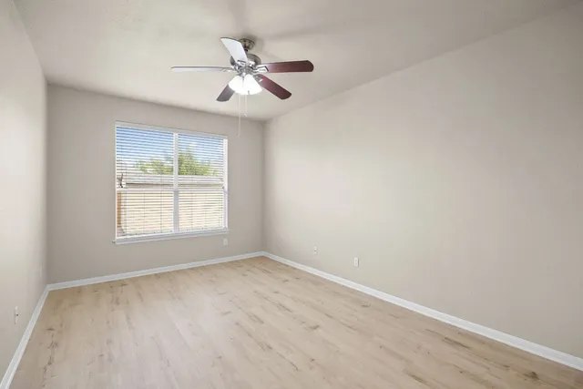 a bathroom with a sink a mirror and a window