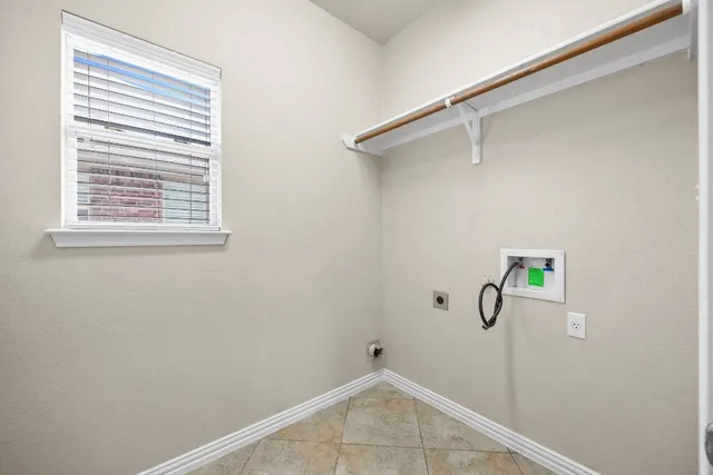 a view of a room with wooden floor and white walls
