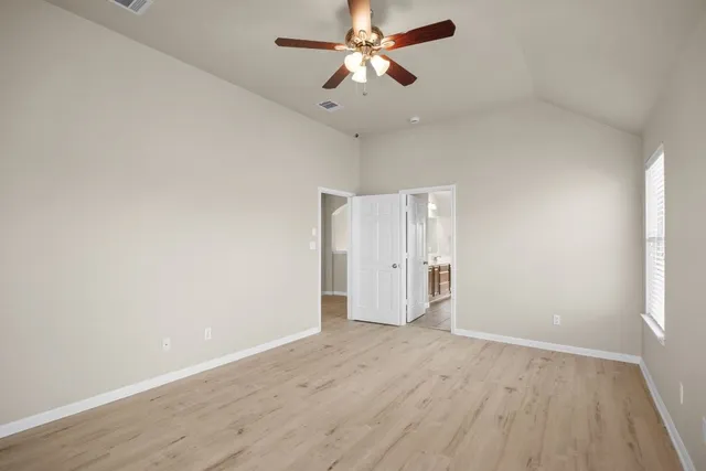 a spacious bathroom with a double vanity sink and a mirror