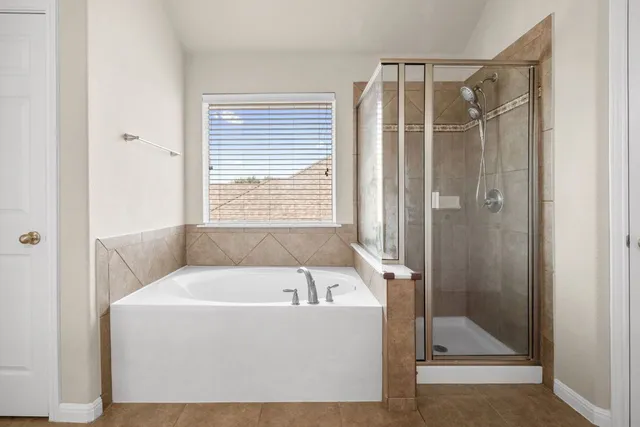 a view of a room with rack on the wall and a window