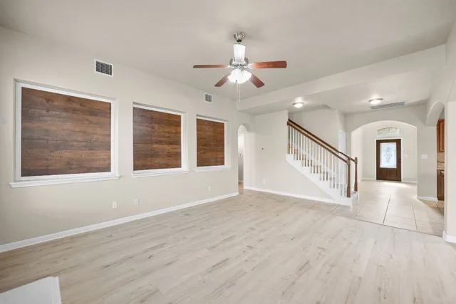 a view of an empty room with a window